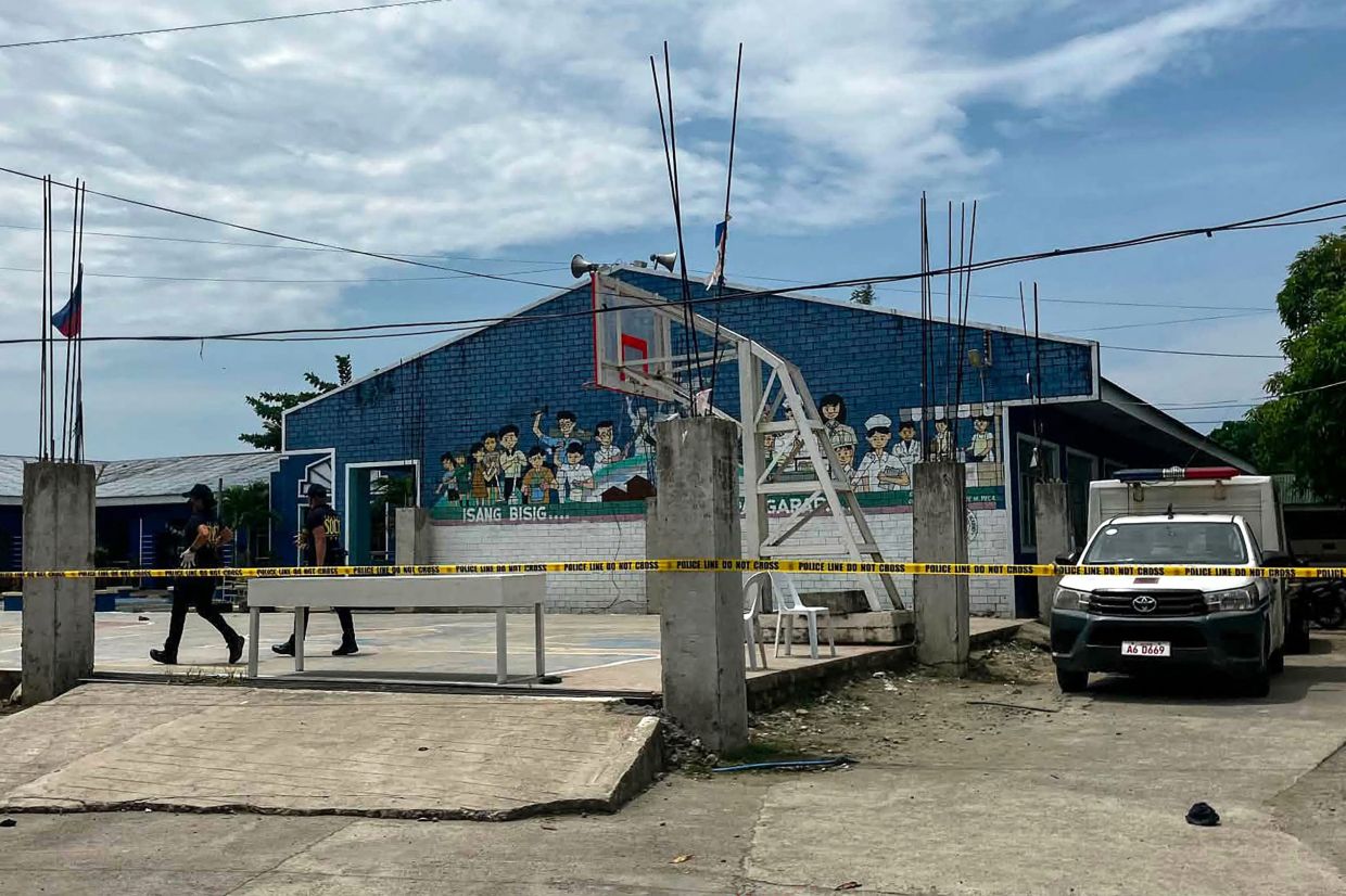Two teenage students arrested after opening fire at Philippine high school, killing three classmates